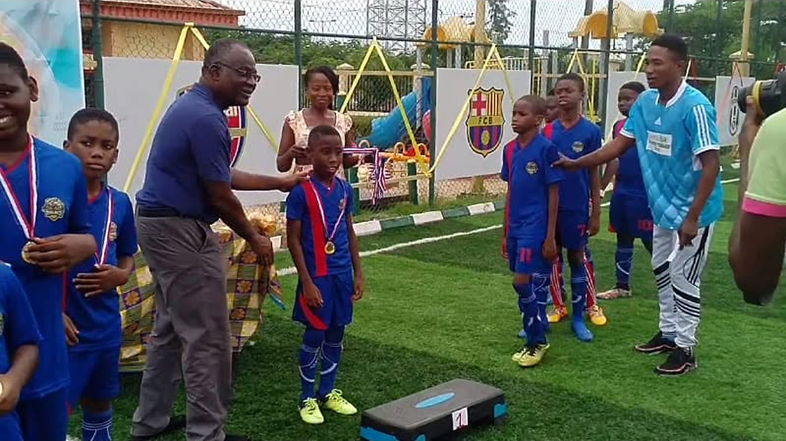 Young players receiving medals at an ISAKA Sports tournament
